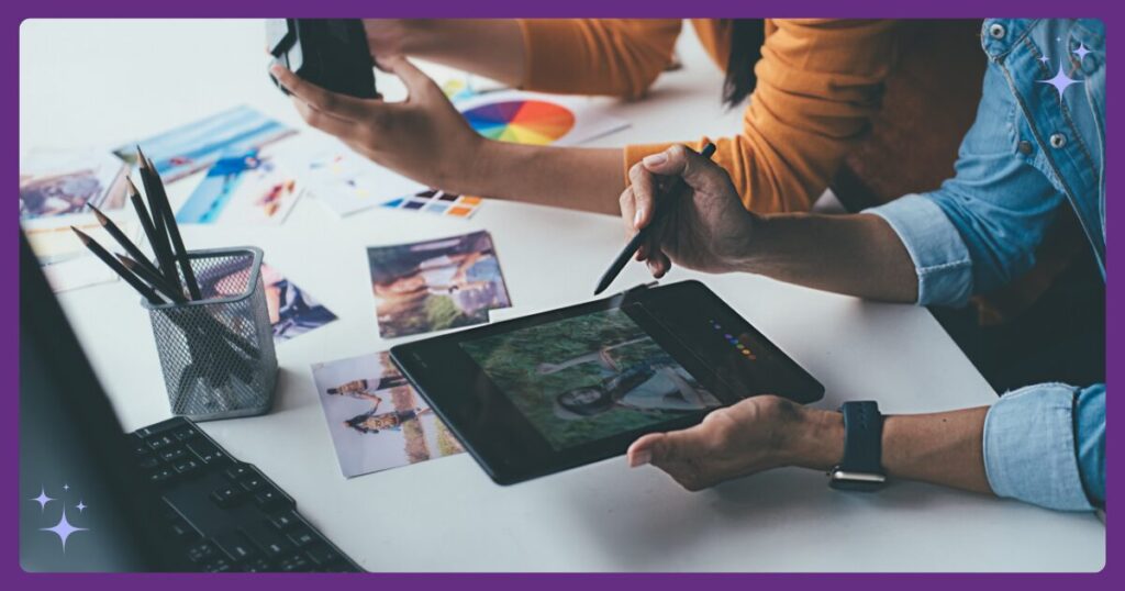 A picture of a hand holding a tablet and a table with various pictures